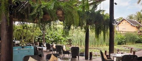 Breakfast, lunch, dinner served; Laotian cuisine, garden views