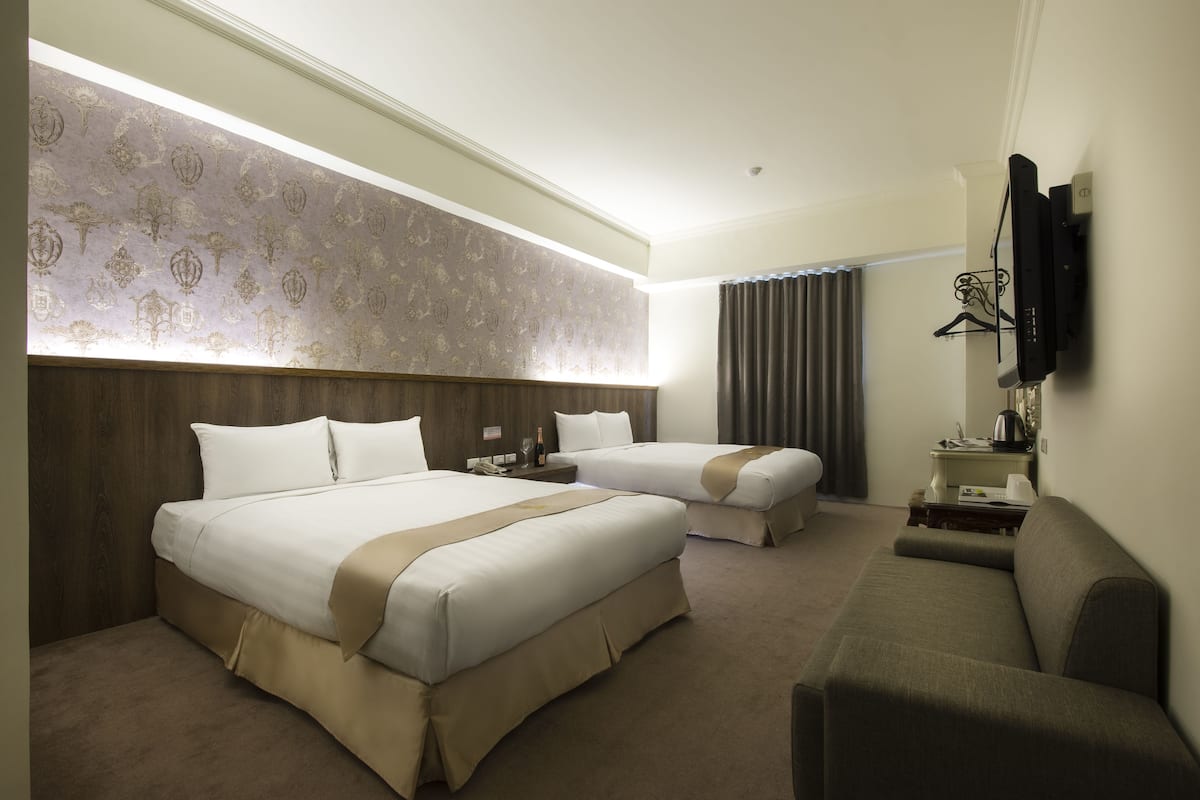 Deluxe Quadruple Room | Down comforters, free WiFi