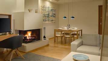 Superior Suite, 2 Bedrooms, Sea View | Living room | 32-inch flat-screen TV with cable channels, TV, fireplace