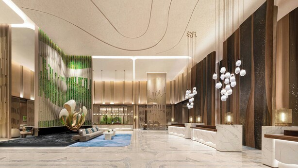 Um lobby moderno com balcão de recepção, área de estar e painéis decorativos na parede.