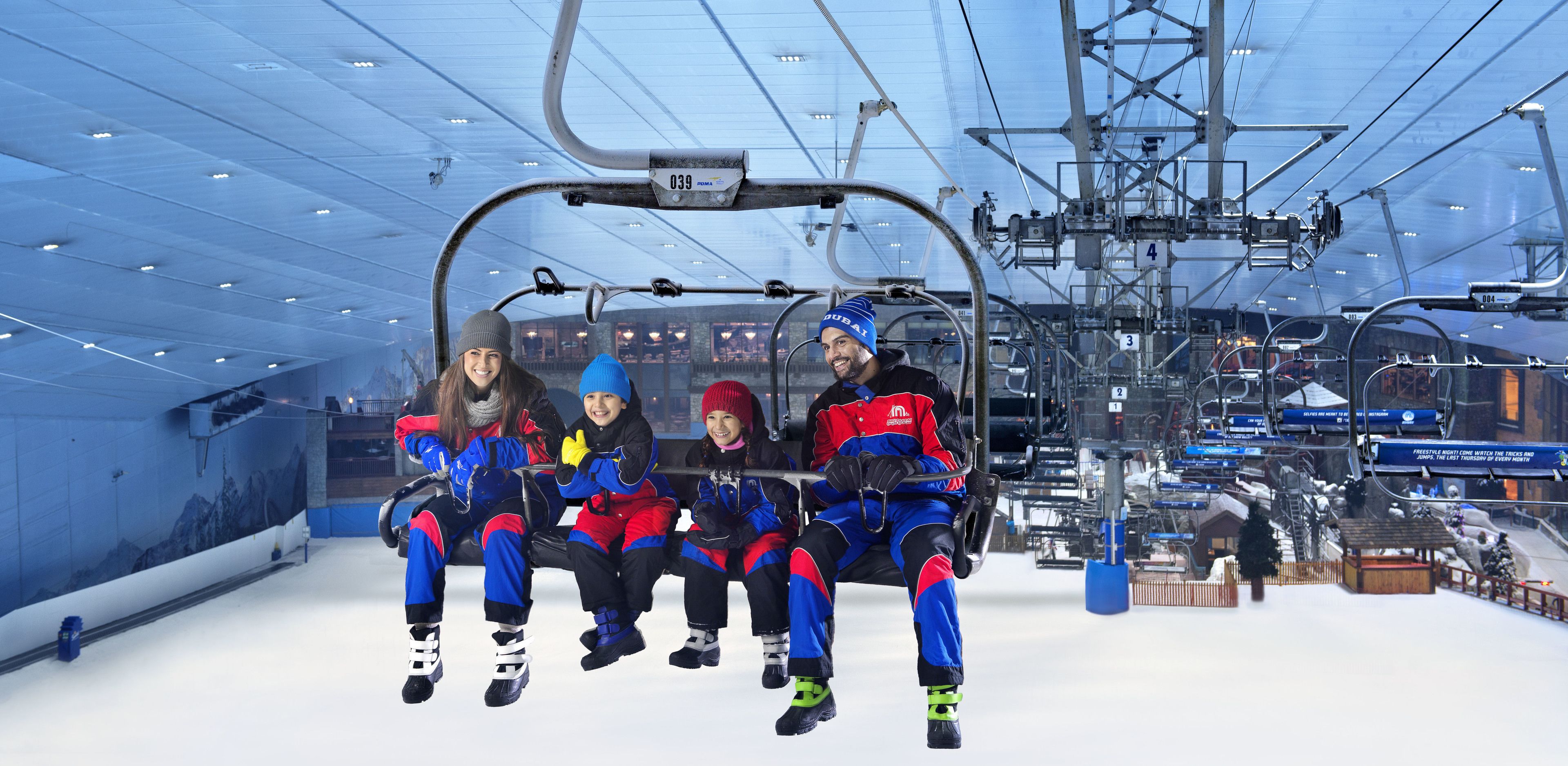 A ski lift with passengers in winter gear.