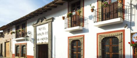 A traditional building with a sign reading "HOTEL".