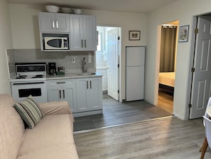 Family Suite, 2 Bedrooms, Kitchen | Private kitchen | Microwave, coffee/tea maker, electric kettle