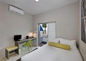 Design Room, 1 Queen Bed, Refrigerator | Individually decorated, individually furnished, blackout curtains, WiFi - Mont Caribe GuestHouse (San Juan)