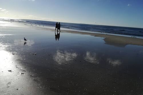 Beach nearby, white sand, beach towels