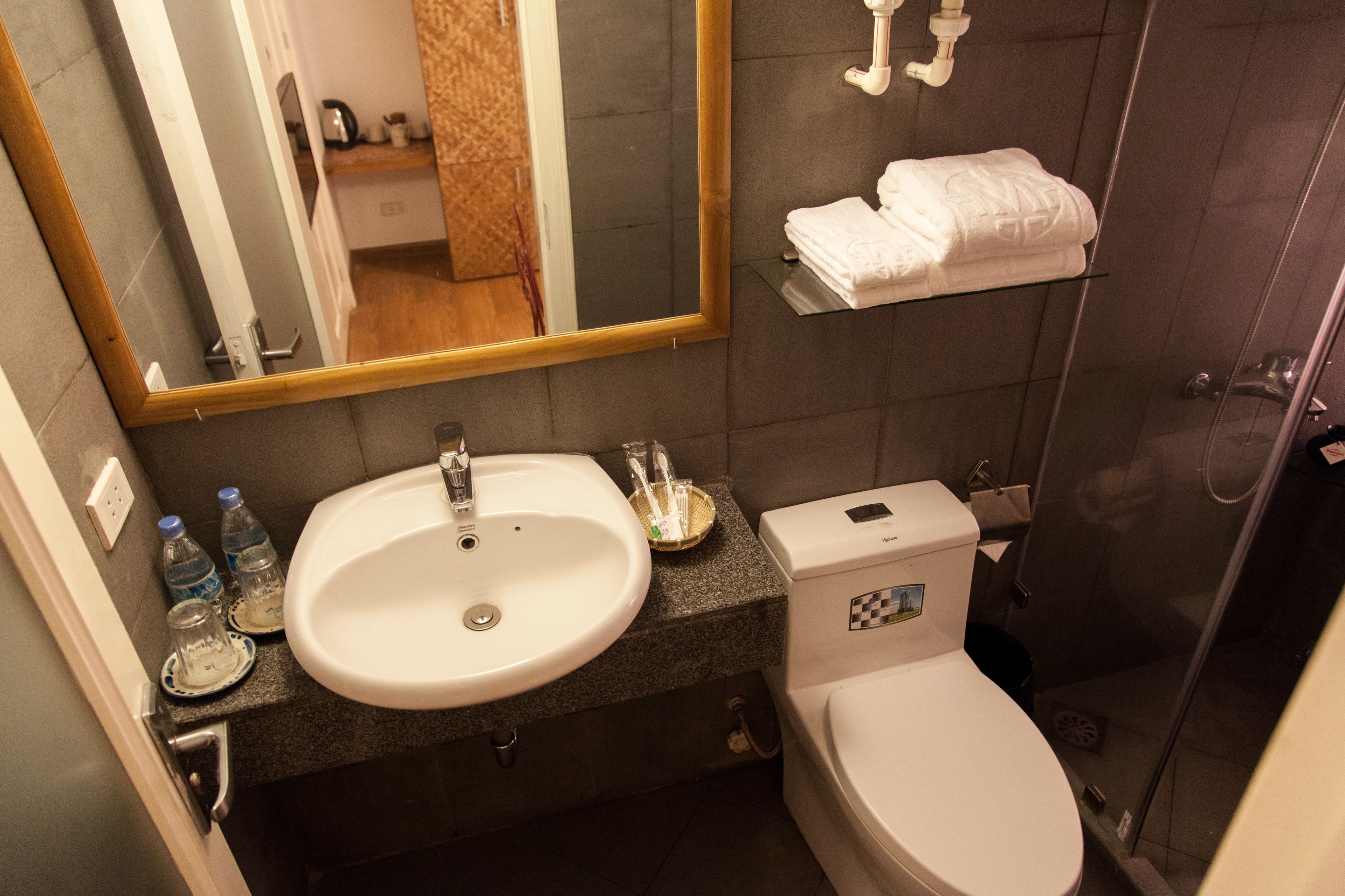 0b | bathroom | shower, free toiletries, hair dryer, slippers