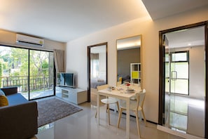 Standard Apartment | Living area | 32-inch flat-screen TV with cable channels, TV, DVD player