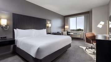 Premium bedding, desk, laptop workspace, iron/ironing board