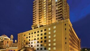A high-rise hotel with multiple floors, large windows, and a prominent sign at the top. - New Town Suites at Bandar Sunway (Petaling Jaya)