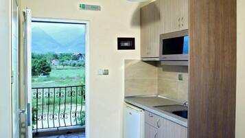Apartment, 2 Bedrooms | Private kitchenette | Fridge, stovetop, coffee/tea maker, cookware/dishes/utensils