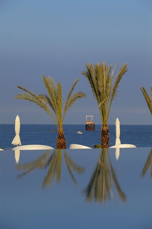Indoor pool, outdoor pool, pool umbrellas, sun loungers