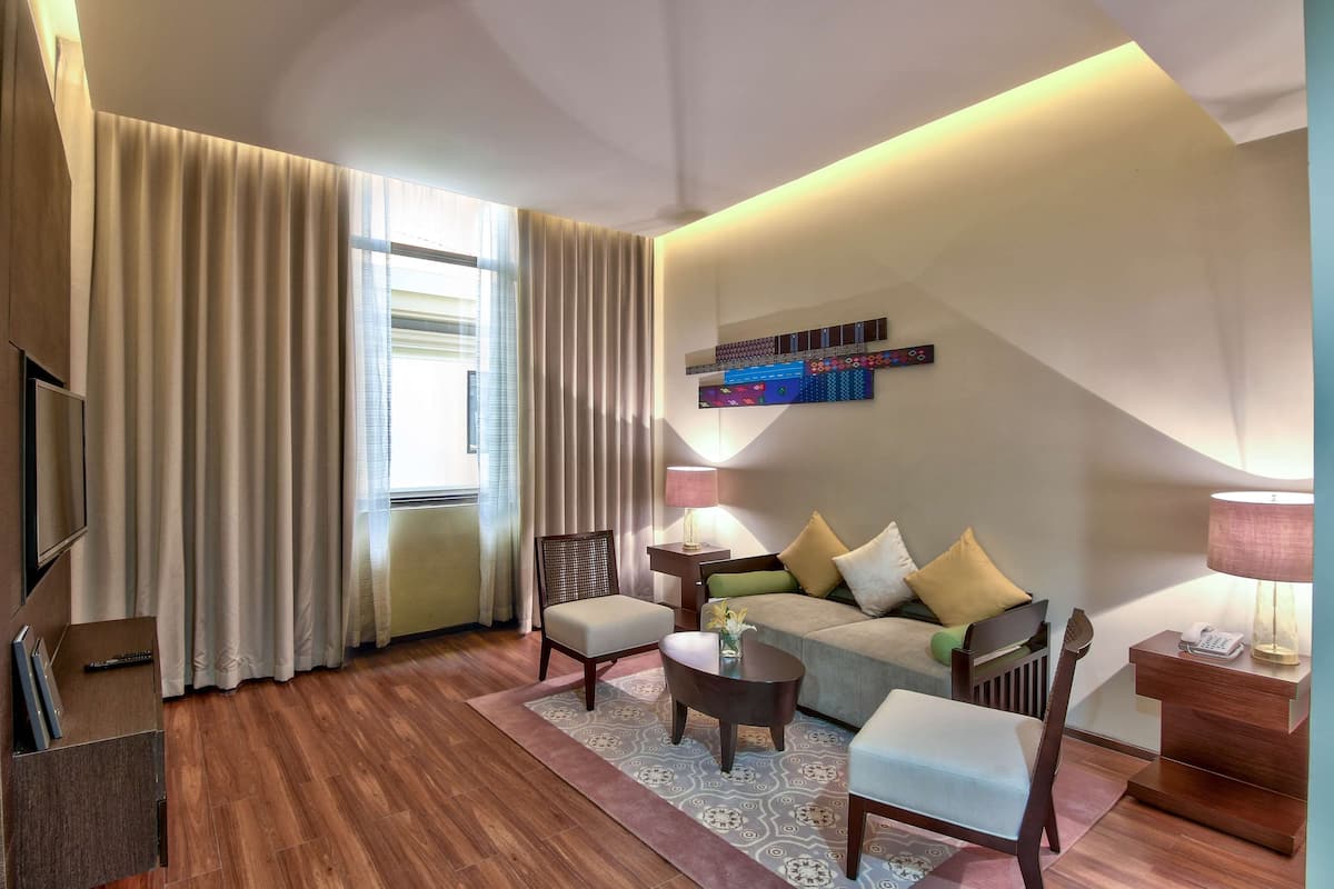 Superior Suite, 1 King Bed (King) | Living area | 32-inch LCD TV with satellite channels, TV, DVD player