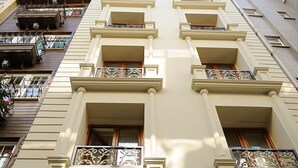 A hotel facade with balconies, a sign reading "Sunlife Hotel," and a logo for "SULTANAHMET." - Sunlife Hotel Old City (Istanbul)