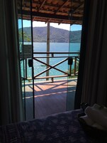 Standard Room, Balcony, Ocean View | Minibar, in-room safe, blackout drapes, bed sheets