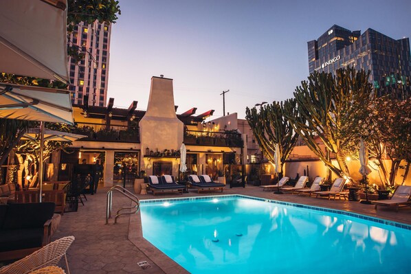 Outdoor pool, open 8:00 AM to 8:00 PM, pool umbrellas, pool loungers