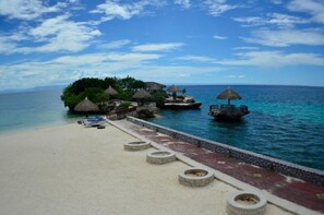 On the beach, sun loungers, beach umbrellas, snorkeling