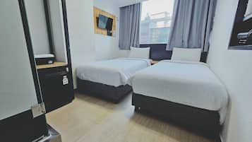 Twin Room | Blackout drapes, iron/ironing board, free WiFi, bed sheets