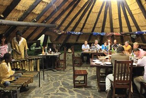 Guests can dine and socialize at the rustic dining area.