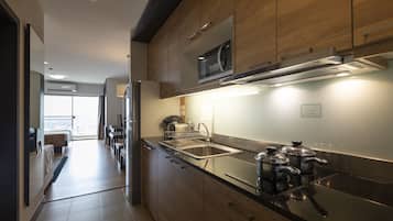 One Bedroom Suite | Private kitchen | Full-size fridge, coffee/tea maker, cookware/dishes/utensils