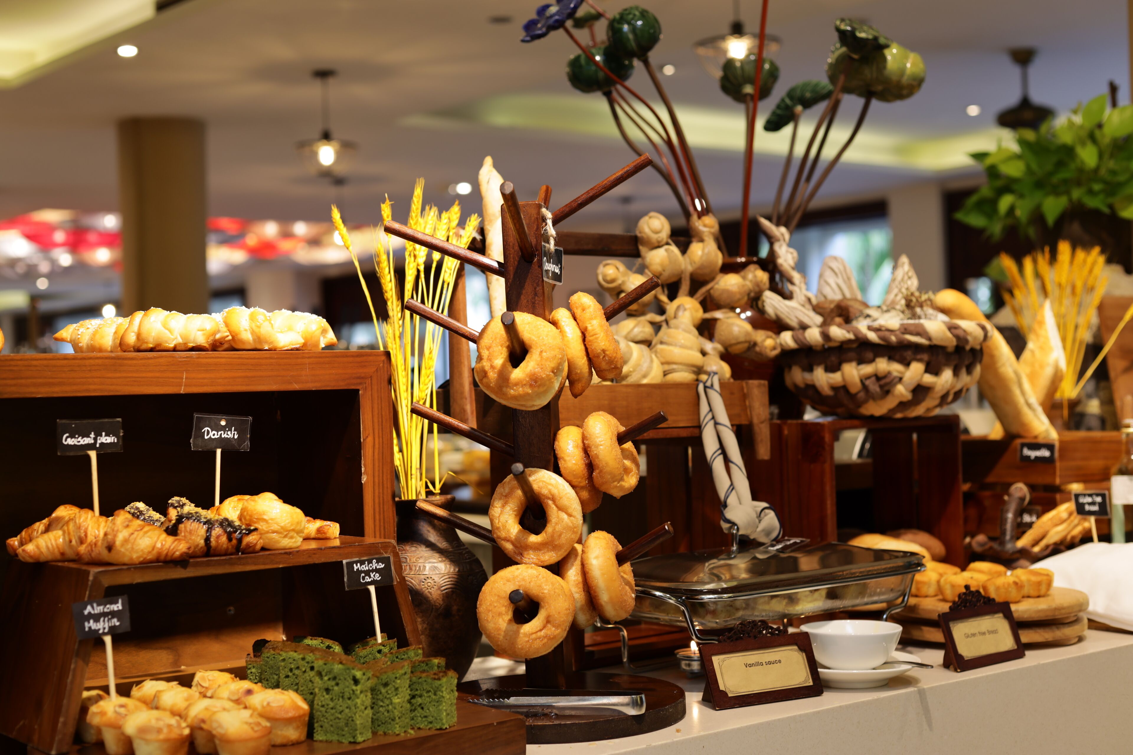 A bakery display with various pastries and bread.