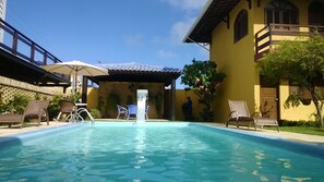 Outdoor pool, open 8 AM to 8 PM, pool umbrellas, pool loungers