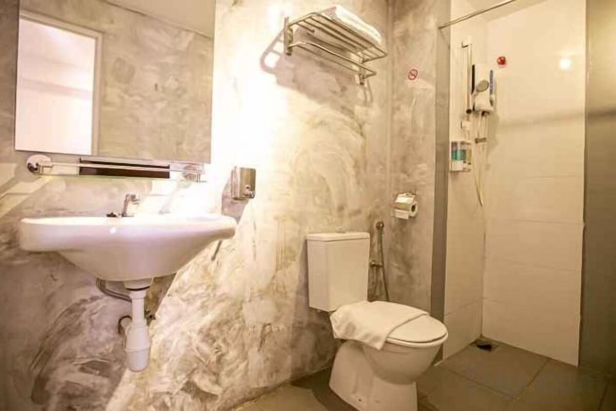 Hair dryer, slippers, bidet, towels
