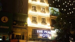 A hotel with a sign reading "The Pearl Hotel" at night. - The Pearl Hotel (Hanoi)