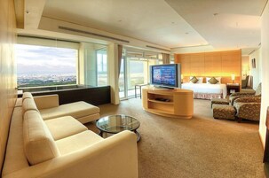 Deluxe Room, 1 Bedroom, Balcony, Tower | Living area | LCD TV