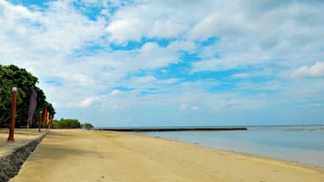 On the beach, sun loungers, beach umbrellas, beach towels