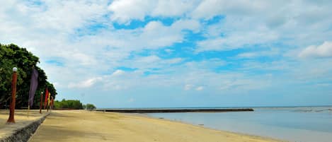 On the beach, sun loungers, beach umbrellas, beach towels