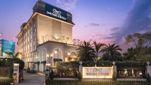 A hotel with a prominent sign reading "NIDHIVAN SAROVAR PORTICO". - Nidhivan Sarovar Portico Vrindavan (Mathura)