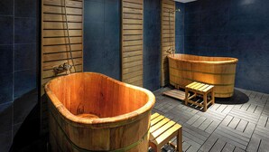 A wooden bathtub and a wooden shower in a bathroom with dark blue tiles. - Hotel Sapa Square, Affiliated by Meliá (Sa Pa)