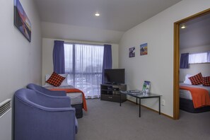 Apartment, 1 Bedroom | Living area | 32-inch LCD TV with premium TV channels, TV - Deans Bush Motel (Christchurch)