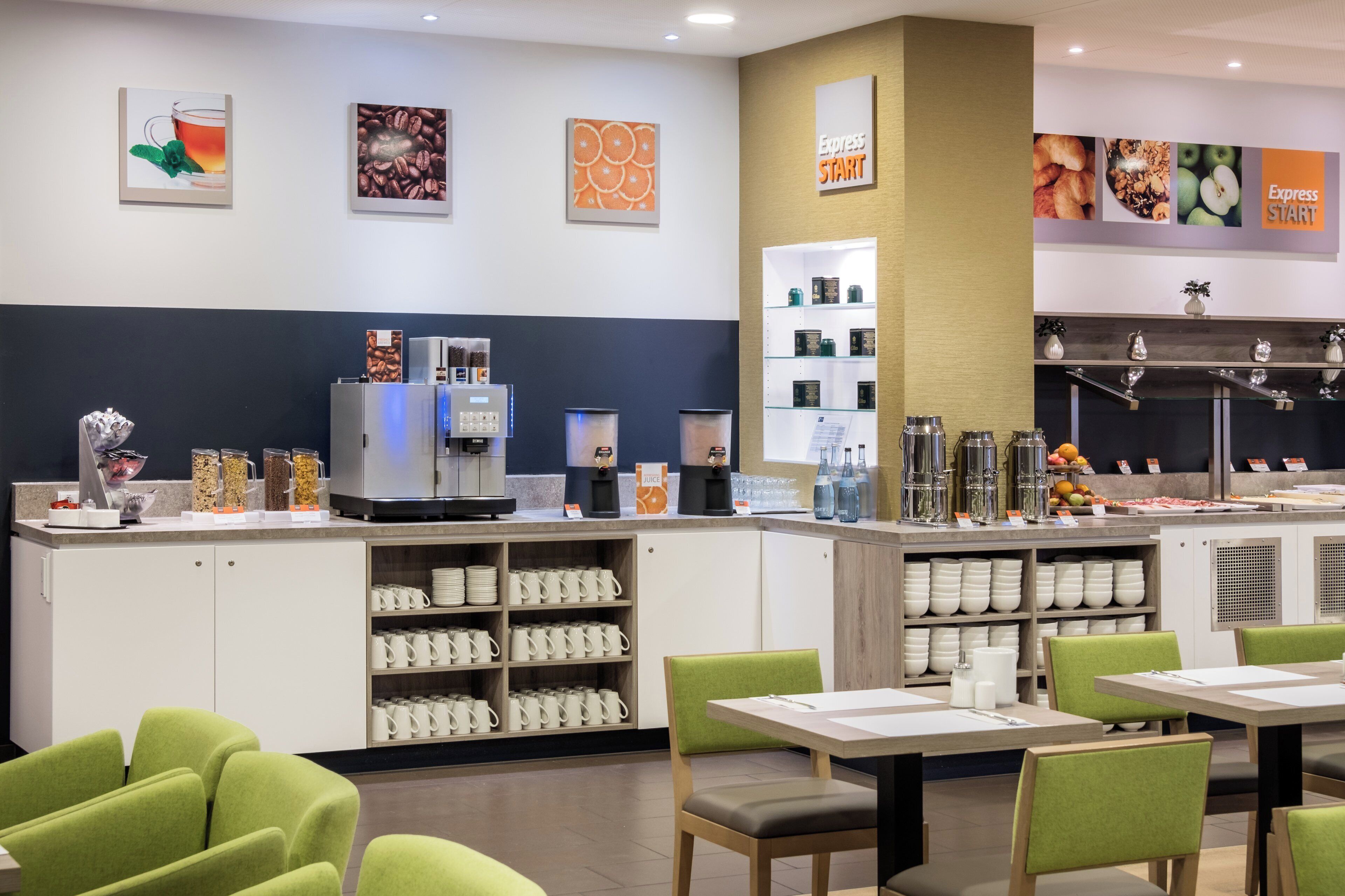 A modern cafe with a coffee station, seating area, and a wall with 'Express Start' signage.