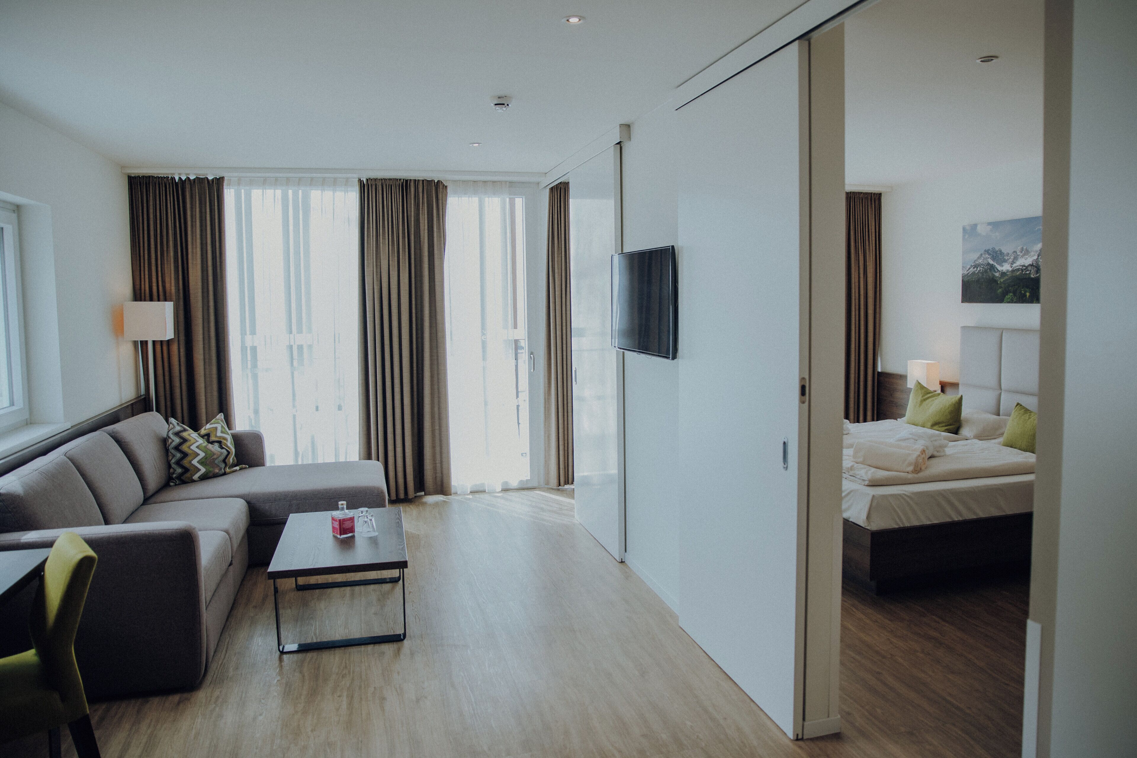 junior suite, balcony | living area | 80-cm flat-screen tv with cable channels