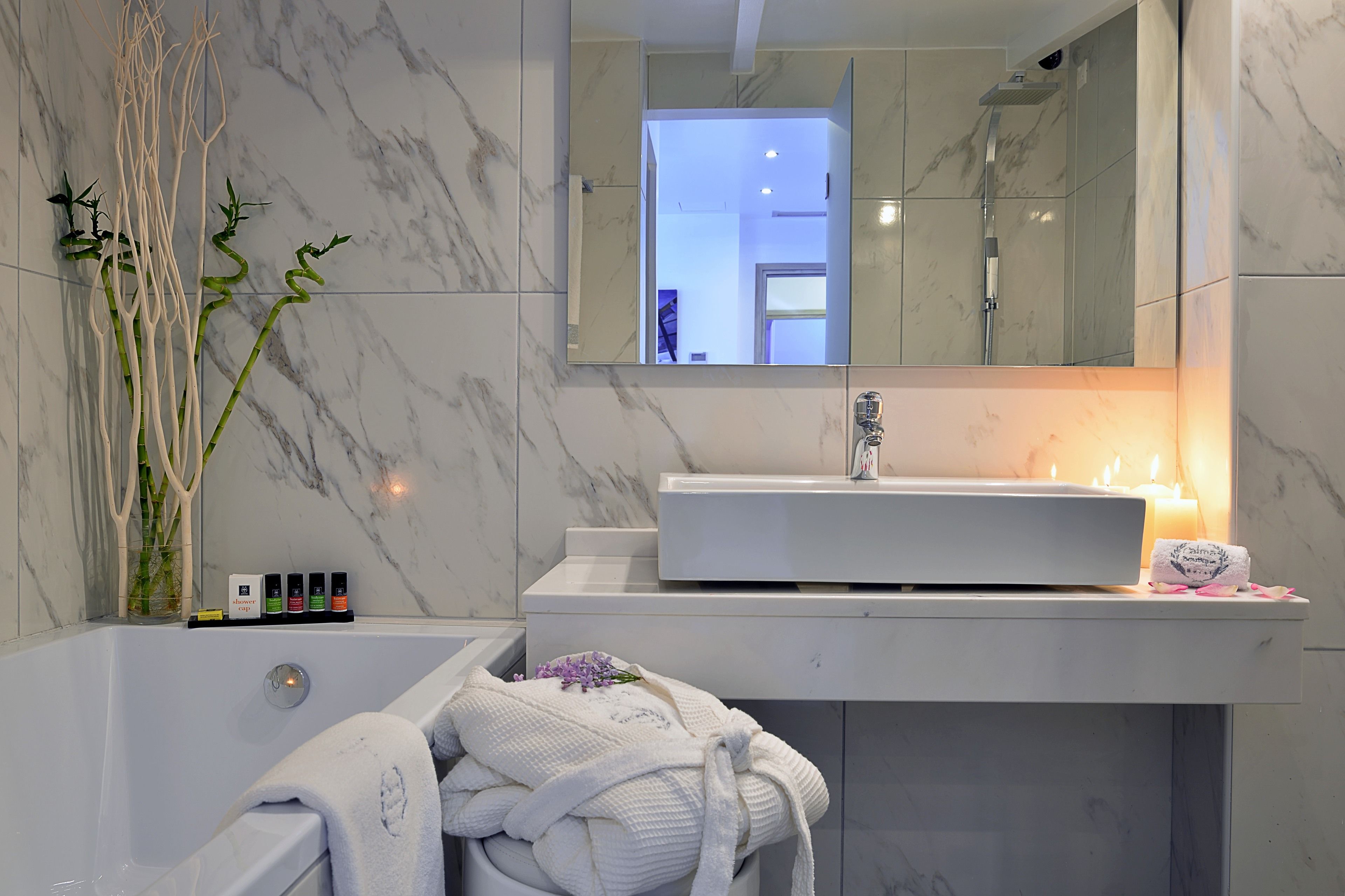 rainfall showerhead, designer toiletries, hair dryer, bathrobes