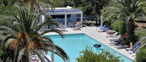 Seasonal outdoor pool, open 10:00 AM to 7:00 PM, pool umbrellas