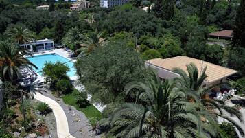 Seasonal outdoor pool, open 10:00 AM to 7:00 PM, pool umbrellas