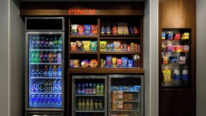 A vending machine area with various snacks and drinks. - Towneplace Suites Anchorage Midtown (Anchorage)