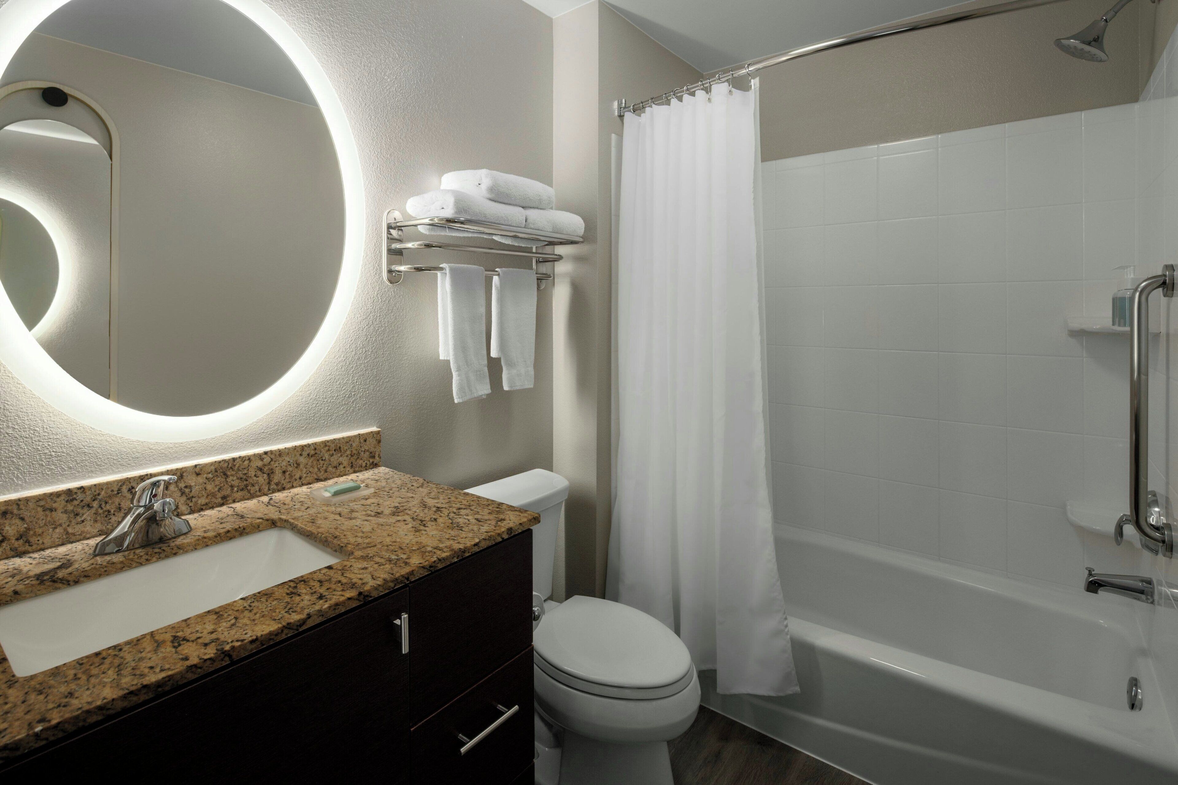 Combined shower/bathtub, designer toiletries, hair dryer, towels