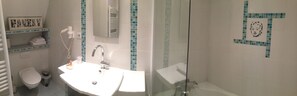 A bathroom with a white sink, a mirror, a towel rack, and a glass shower enclosure. - Hôtel & Spa Rodier (Campagnac)