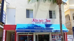 Alicia's Inn Guest House with a sign for Victor's Cosmetics. - Alicia's Inn (Philipsburg)