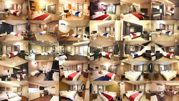 A hotel room with a bed, desk, and seating area.