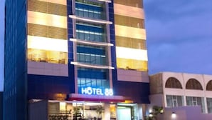 A modern hotel building with a prominent sign reading "HOTEL 88". - Hotel 88 Mangga Besar VIII by WH (Jakarta)