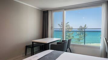 Family Quadruple Room, Ocean View | Desk, laptop workspace, blackout drapes, soundproofing
