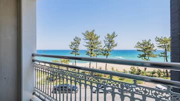 Family Triple Room, Balcony, Ocean View | Desk, laptop workspace, blackout drapes, soundproofing