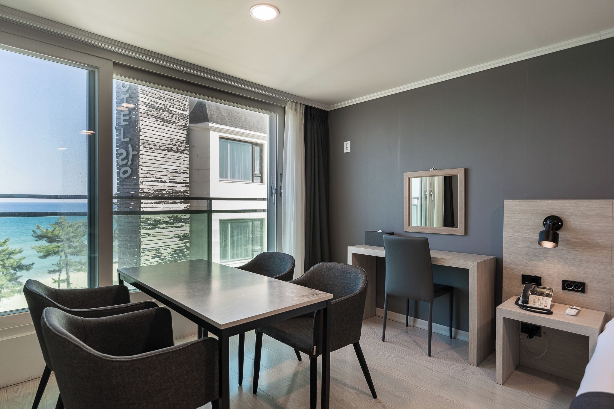 family triple room, partial ocean view | desk, laptop workspace, blackout curtains, soundproofing