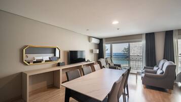 Family Quadruple Room, Partial Sea View | Desk, laptop workspace, blackout drapes, soundproofing