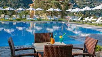 Seasonal outdoor pool, open 9:00 AM to 8:00 PM, free cabanas