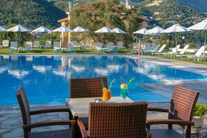 Seasonal outdoor pool, open 9:00 AM to 8:00 PM, free pool cabanas